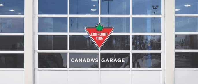 Canadian Tire auto service centre garage door with signage reading “Canada’s Garage”.
