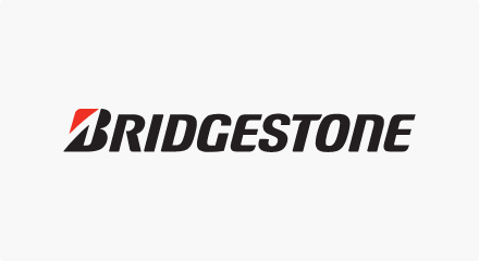 The Bridgestone logo: A black “BRIDGESTONE” wordmark featuring a red-and-black letter “B.”