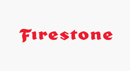 The Firestone logo: A red “Firestone” wordmark in Gothic-like text.