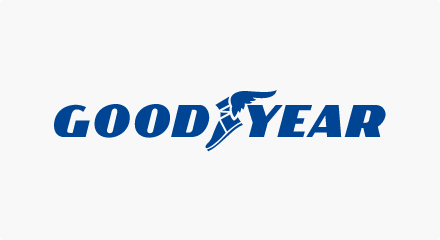 The Goodyear logo: A yellow “GOODYEAR” wordmark with a winged foot wearing a sandal between the letters “D” and “Y.”