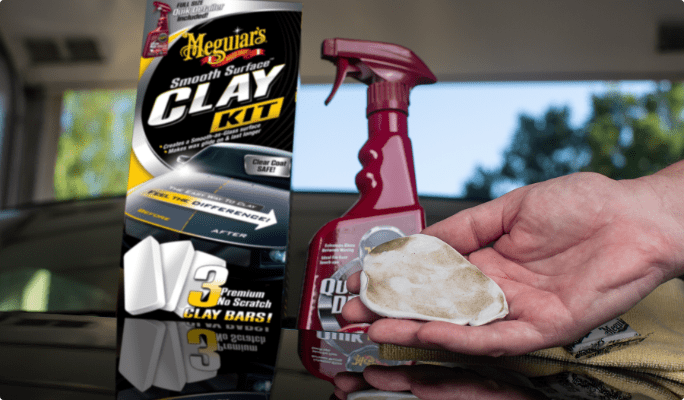 Meguiar’s 5-piece Smooth Surface Clay Kit with hand holding a clay bar.
