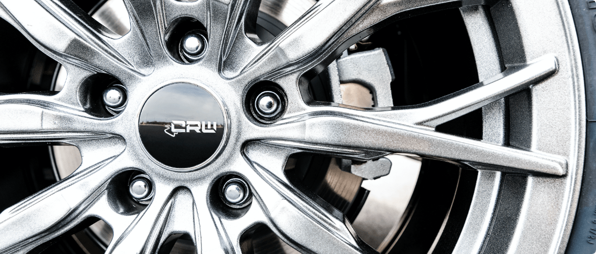 Close-up image of a silver, CRW branded wheel. 