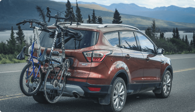 Bikes attached to car rack on vehicle