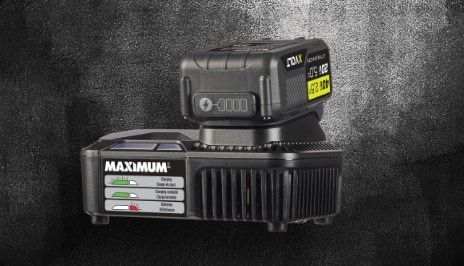 A single MAXIMUM XVOLT battery pack and a single MAXMUM XVOLT 20 and 40 volt fast charger set against a dark grey and black background.
