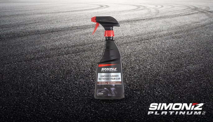 A spray bottle of SIMONIZ Leather Cleaner.
