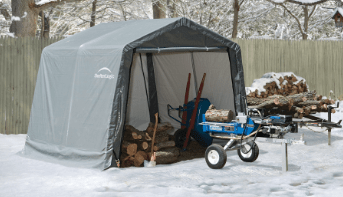 Portable shelter covering wood, wheelbarrow and other equipment.