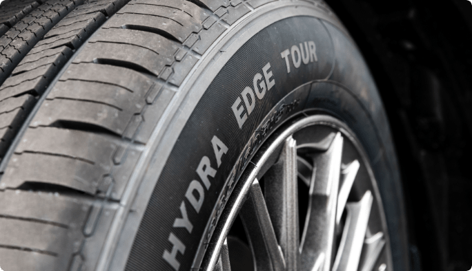 A close-up of a MotoMaster Hydra Edge Tour tire.