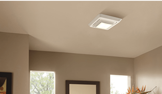 White Broan Bathroom Exhaust Fan Grille with LED on a bathroom ceiling.
