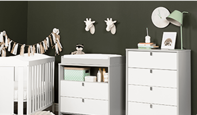 Nursery with white crib and South Shore Cookie changing table and 4-drawer chest in soft grey/pure white.