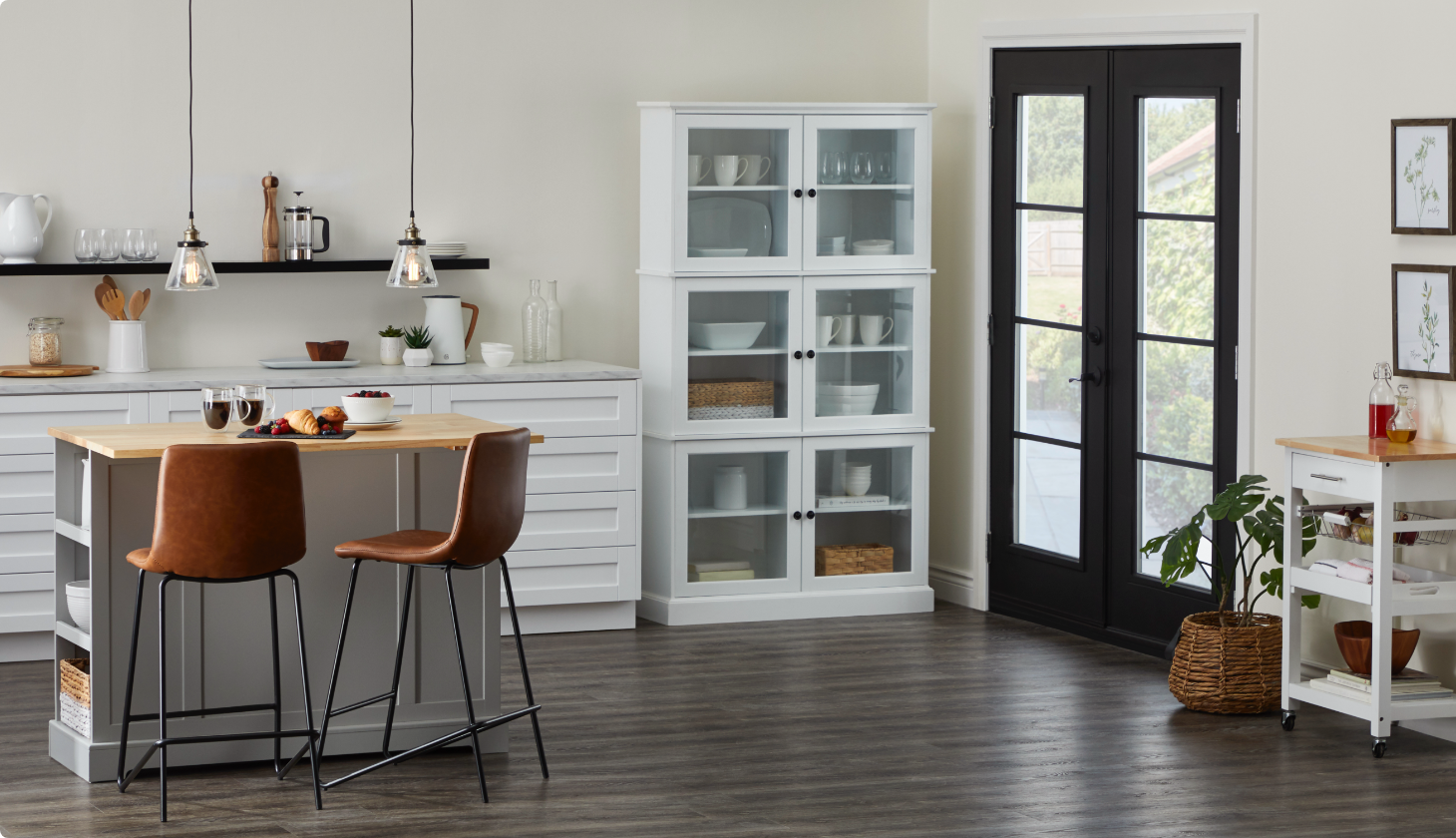 White, black, and brown kitchen with two leather bar stools, white cabinet, and black shelf