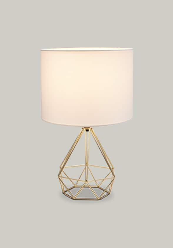 CANVAS Elita geo table lamp with a white shade and gold base.