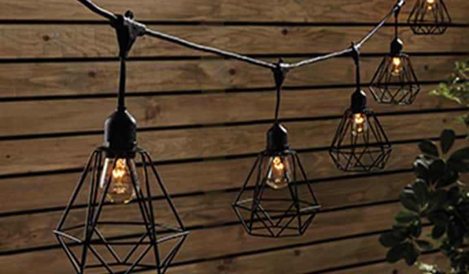 String lights with black geometric cage.