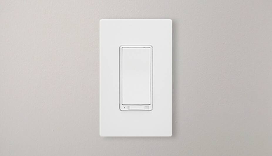 A white dimmer switch in a wall.