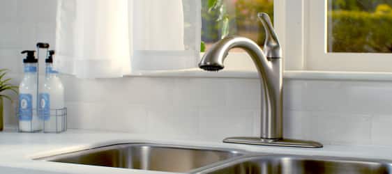 Stainless steel kitchen faucet with stainless steel sink. 
