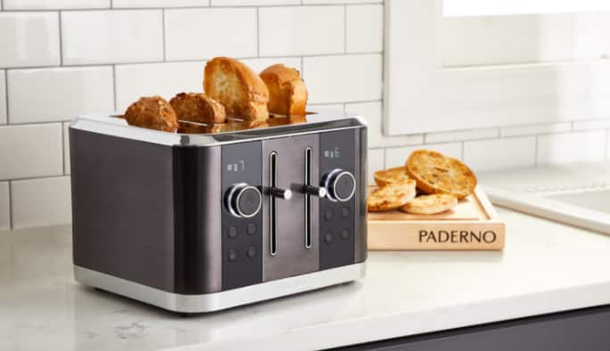 A toaster with slices of toast in it.