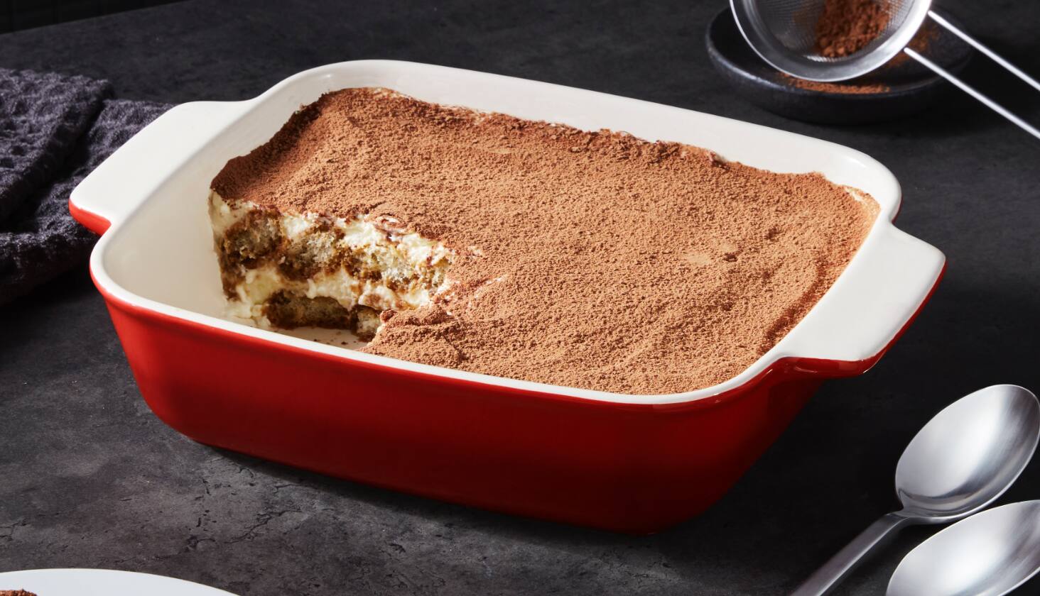 Dessert in a red ceramic bakeware. 