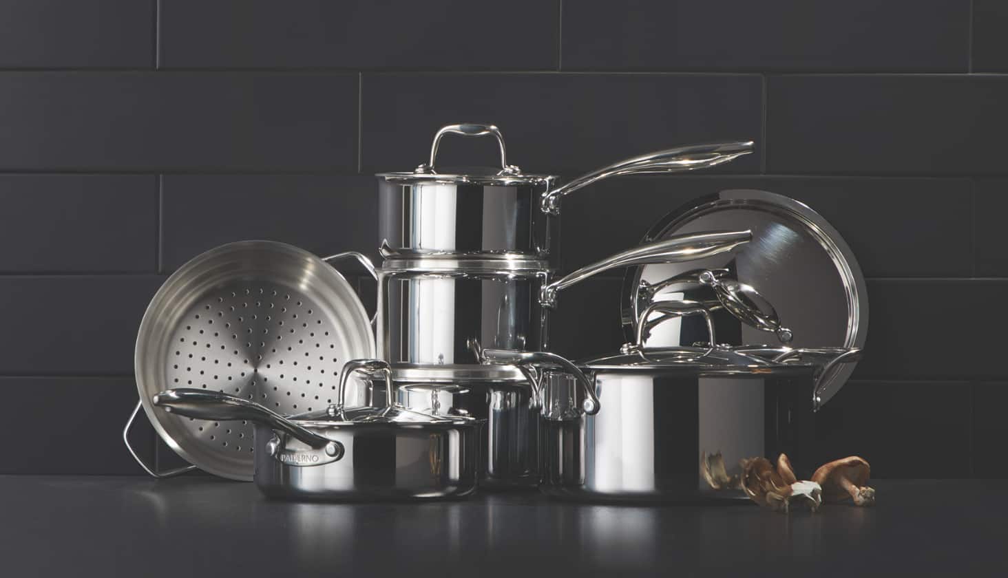 Stainless steel pots and pans on a counter. 