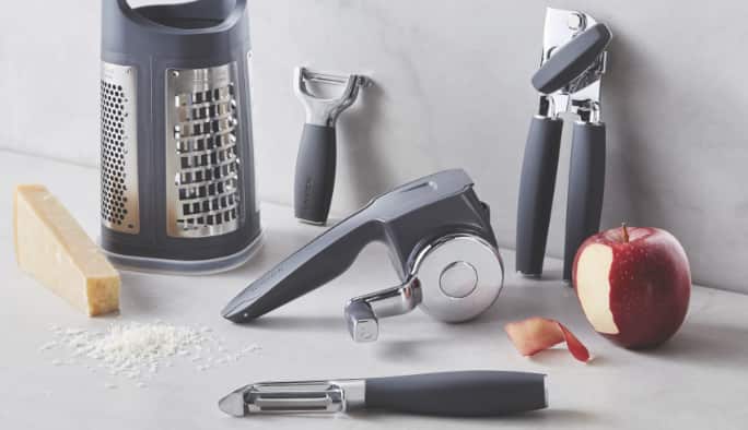 Various kitchen tools and gadgets on a kitchen counter. 