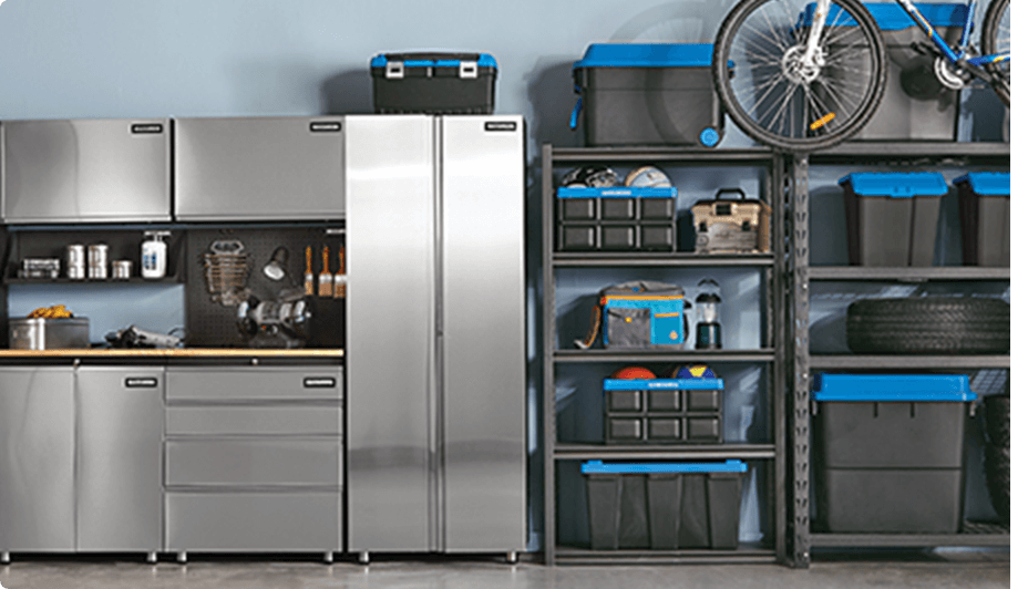 Mastercraft stainless steel storage cabinets, MAXIMUM heavy duty storage racks, and black plastic storage totes with blue lids.