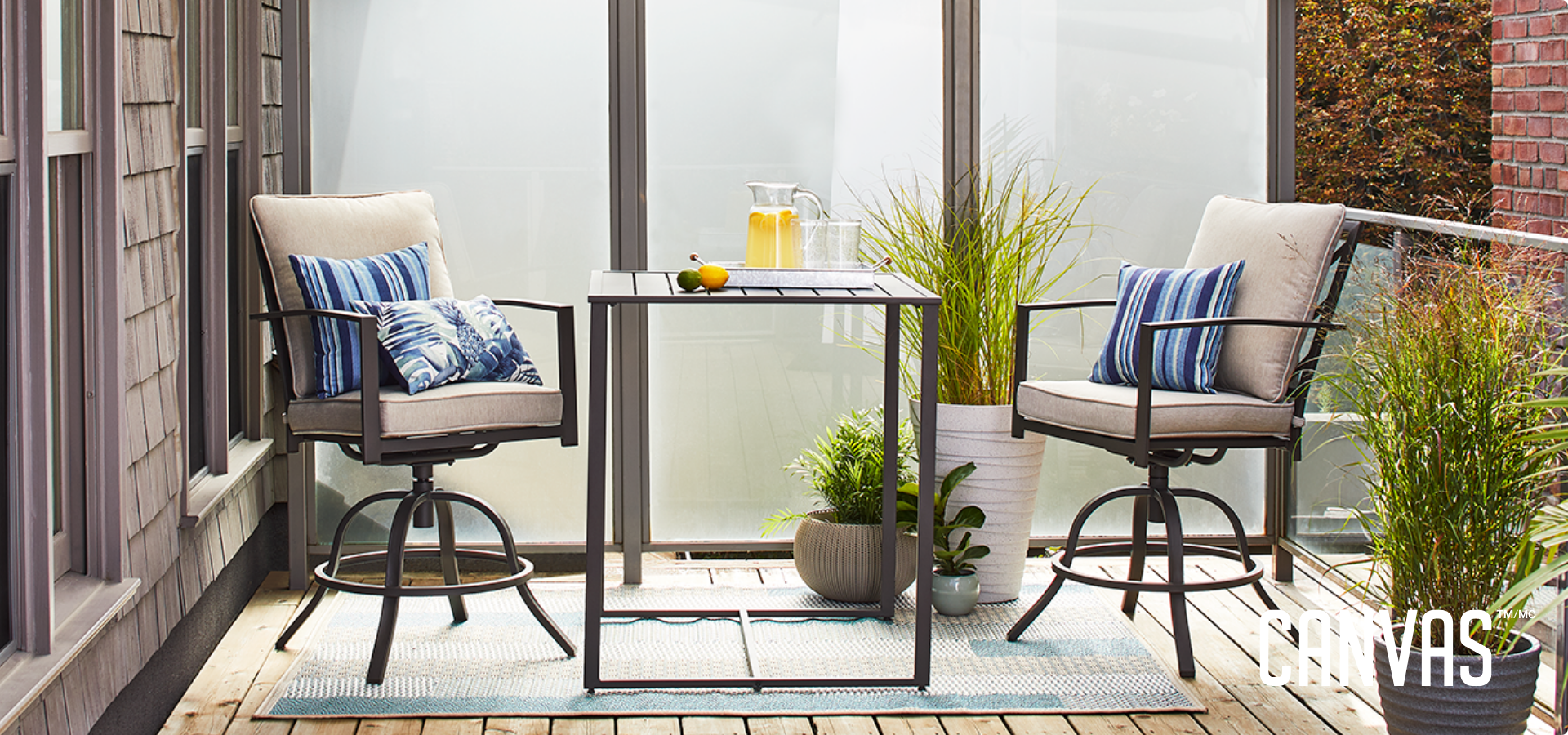 Various outdoor seats and table sets displayed outside in sunlight, from full dining sets to a smaller, intimate coffee table set.