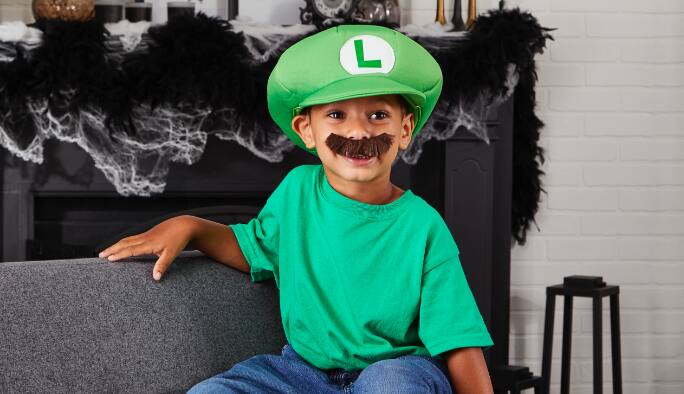 Boy wearing a Luigi Child Accessory kit costume
