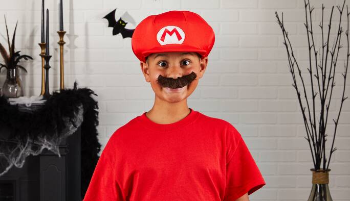 Boy wearing a Mario Child Accessory kit costume