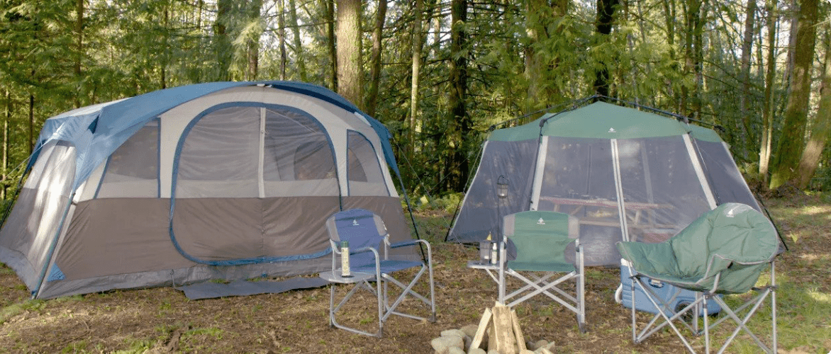 Campsite in a wilderness area with 1 large tent, 1 medium tent, and 3 folding chairs.