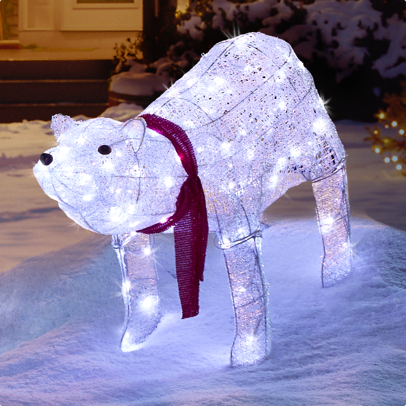 CANVAS 2-ft LED Arctic White Polar Bear  Lit up on a snowy front lawn. 