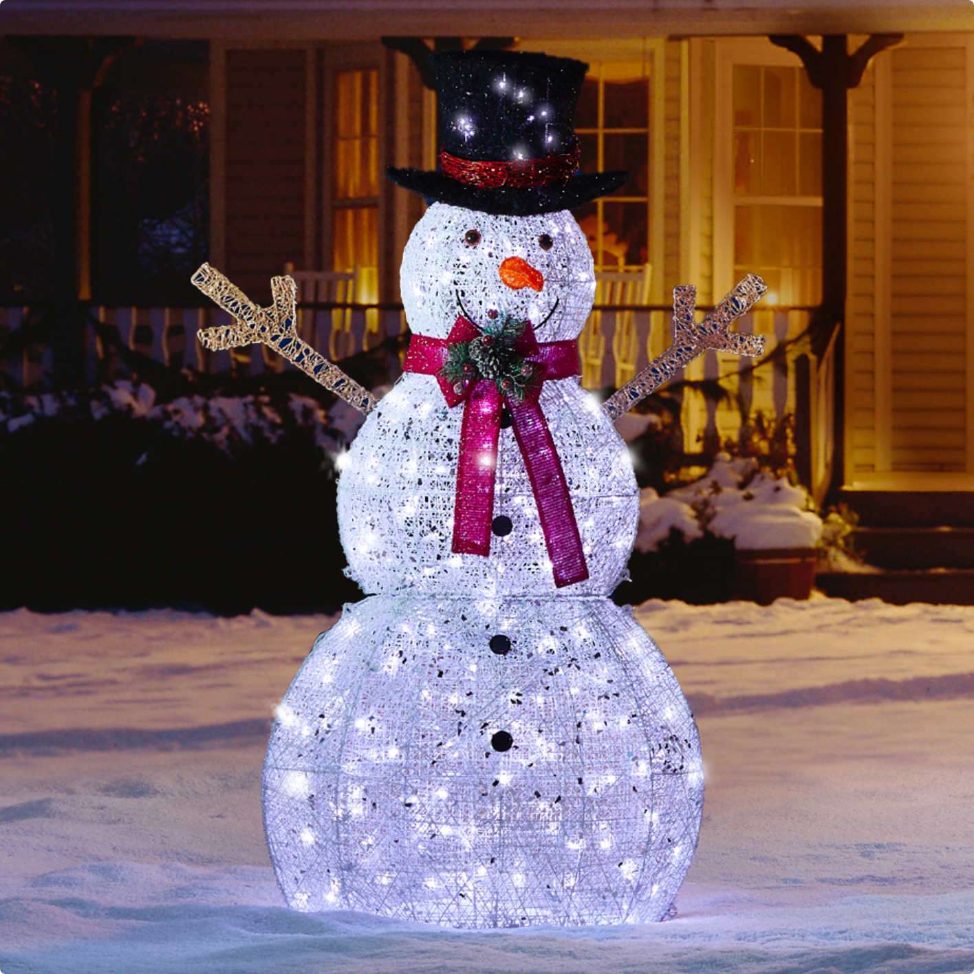 CANVAS 5-ft LED Arctic White Snowman yard decoration in front of a house.