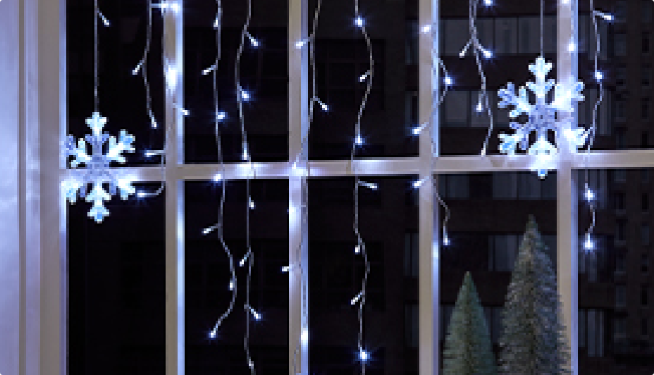 Indoor Christmas lights hanging from a window