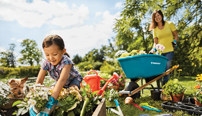 Young girl gardening with mom