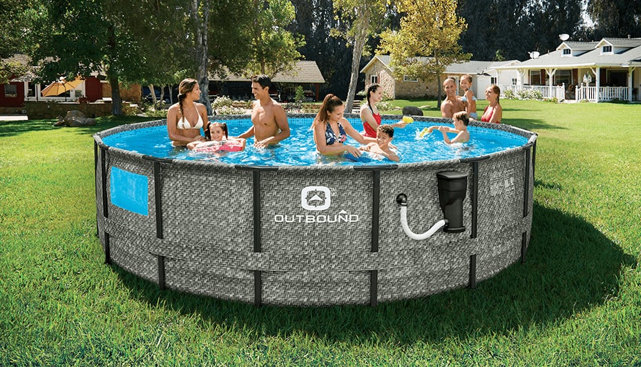 A family enjoys their large above ground Outbound brand swimming pool.