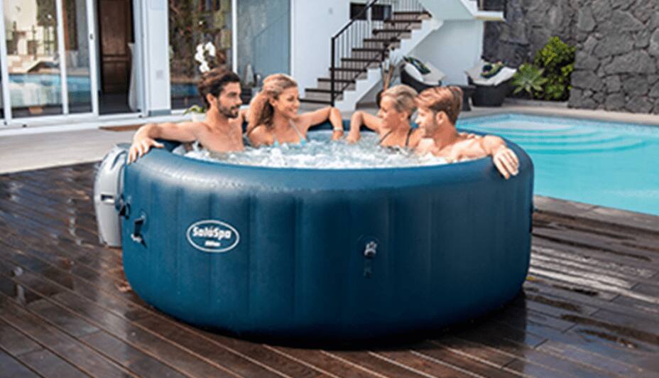 A group of friends enjoy their SaluSpa brand hot tub.