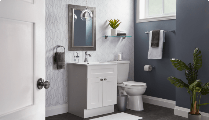 A modern bathroom scene showing a sink, toilet, mirror, shelving and more.