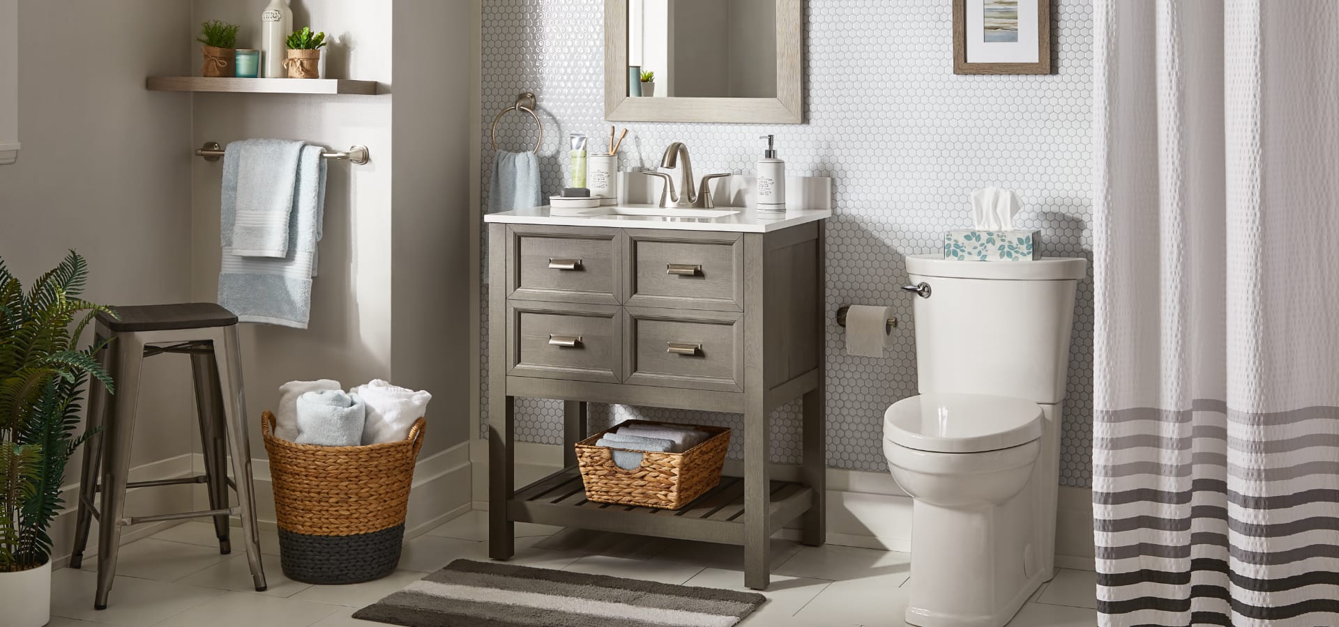A beautifully done up bathroom with a neutral wooden vanity. 