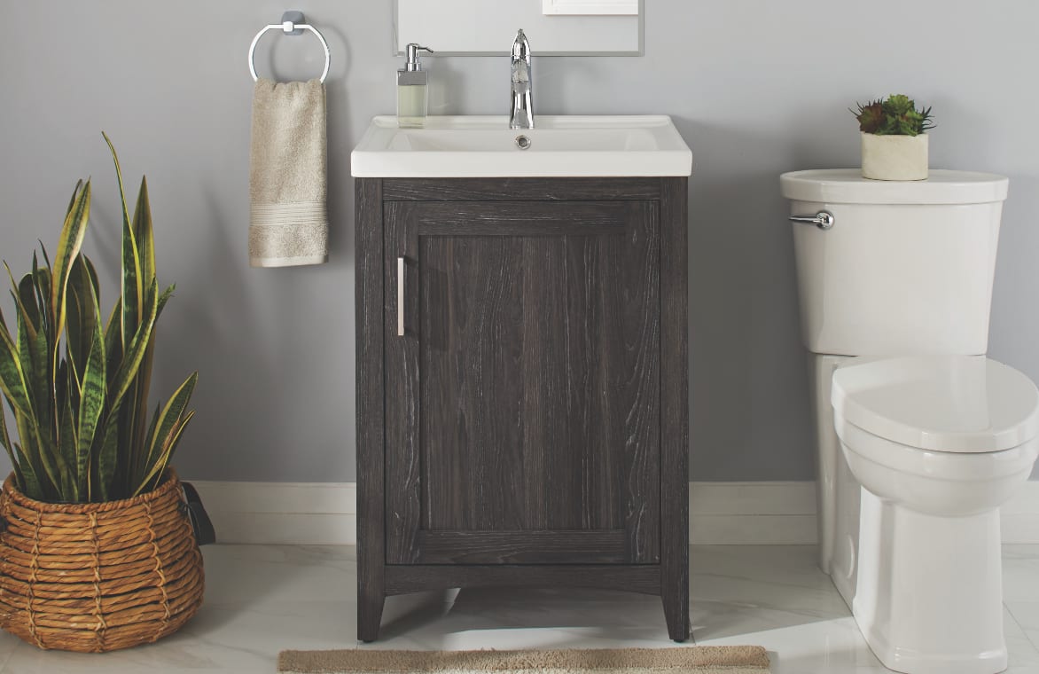 A single sink vanity with a single storage cabinet.