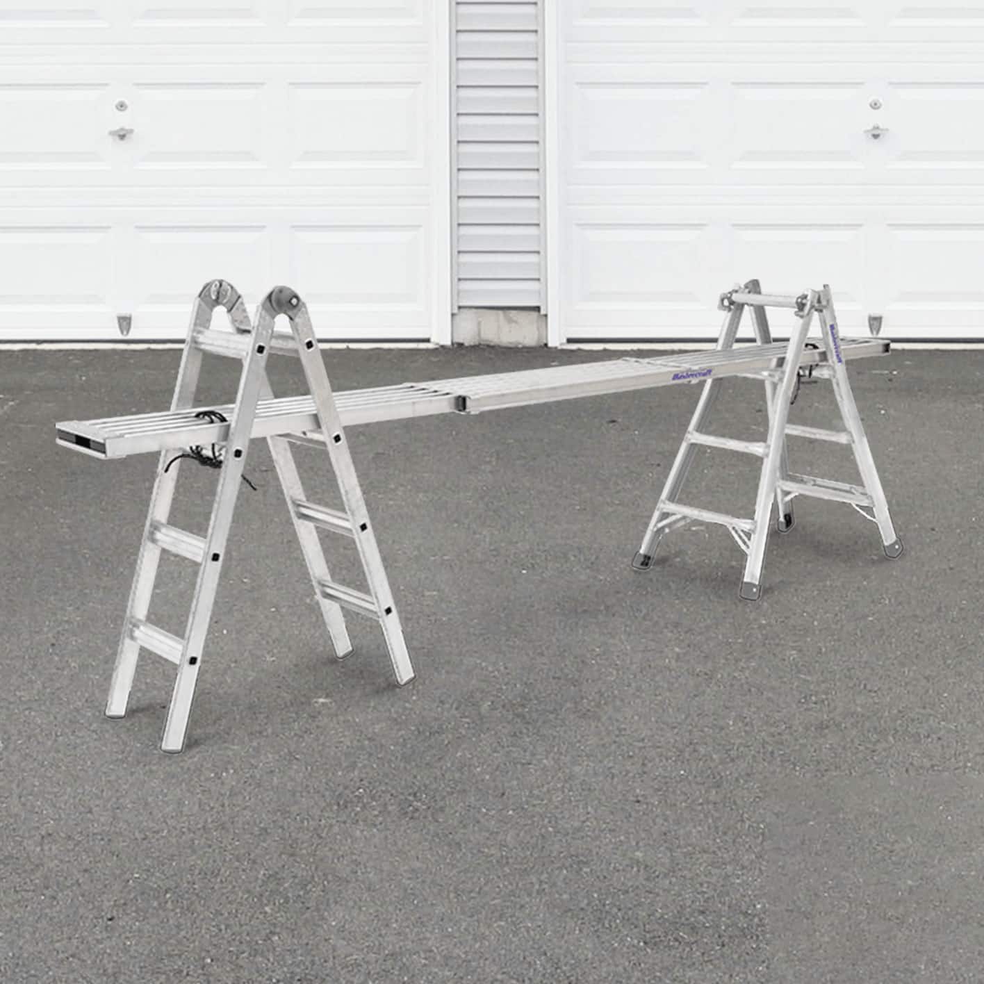 Two Mastercraft ladders with scaffolding