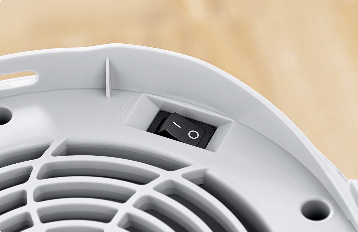 Top view of a NOMA iQ air purifier showing on/off switch