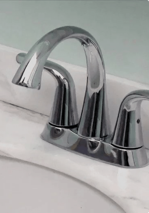Close-up view of a sink faucet.