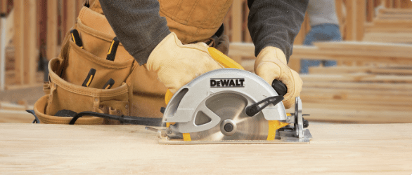 A Skilsaw portable circular saw and Mastercraft jigsaw on a workbench in a garage.