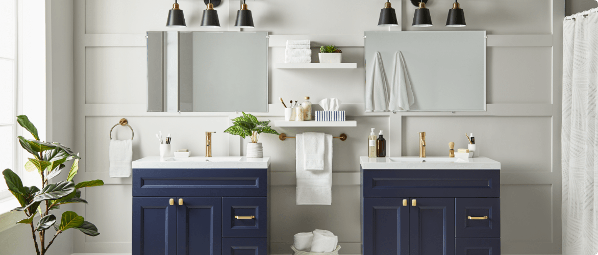 Canvas bathroom vanities in navy blue with gold hardware