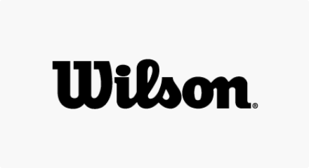 Le logo Wilson Sporting Goods Company : Un mot-symbole « WILSON » en noir.