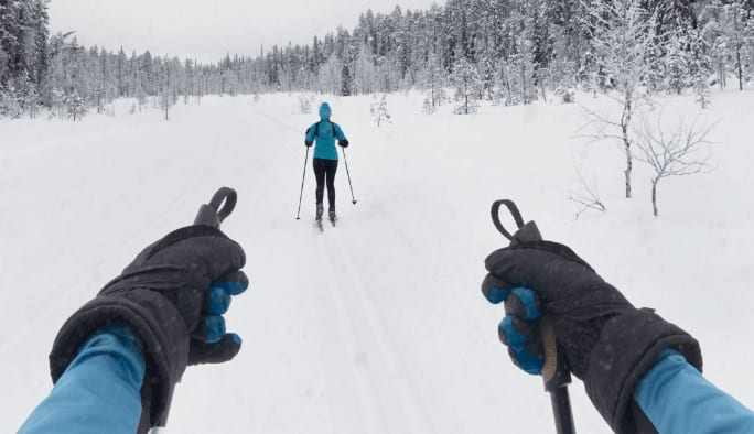 Man wearing gloves while skiing