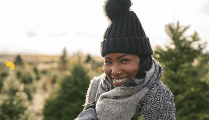 Woman wearing a black winter hat