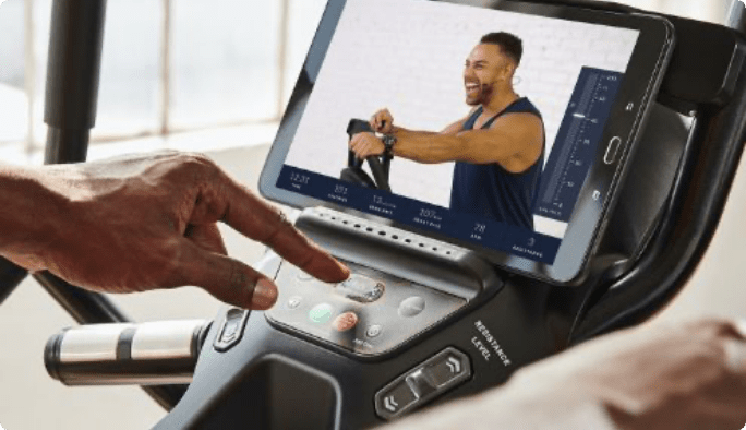 JRNY’s trainer video being played on a workout machine’s screen. 