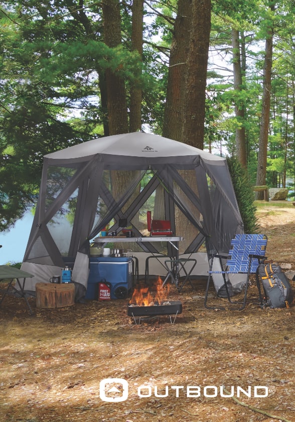 A beautifully set up tent with camping table, chairs and cooler.