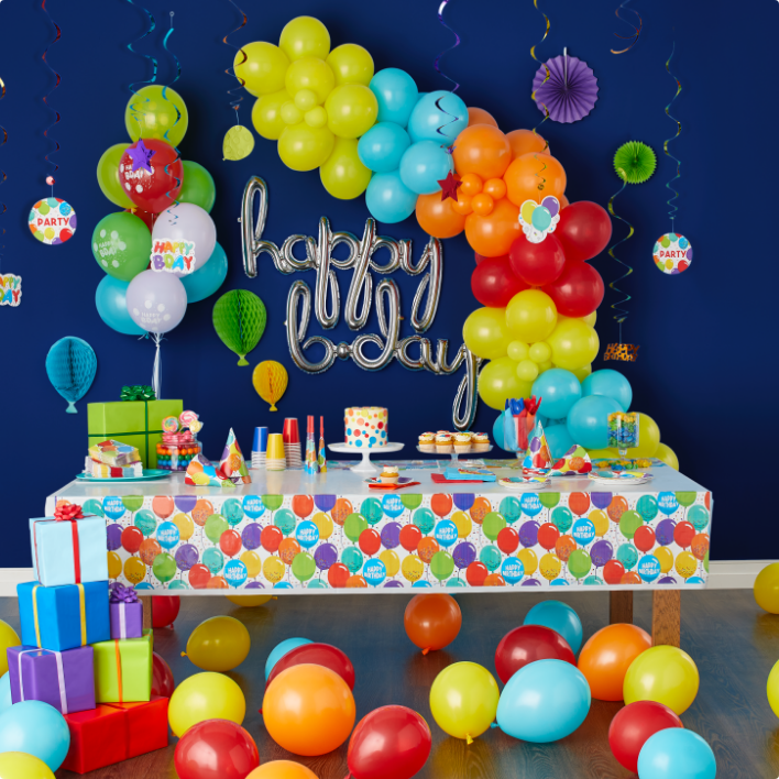Happy birthday balloons and party table