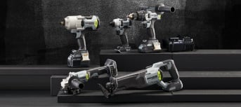 A selection of five power tools from the MAXIMUM brand positioned in various spots against a black and dark grey background. 