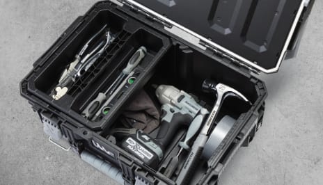 Tools, work gloves and supplies inside a MAXIMUM BRIX modular toolbox storage system.