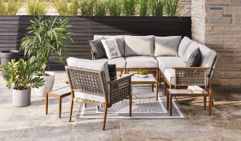Baffin sectional set with armchair, 2 side tables and a coffee table on a patio rug